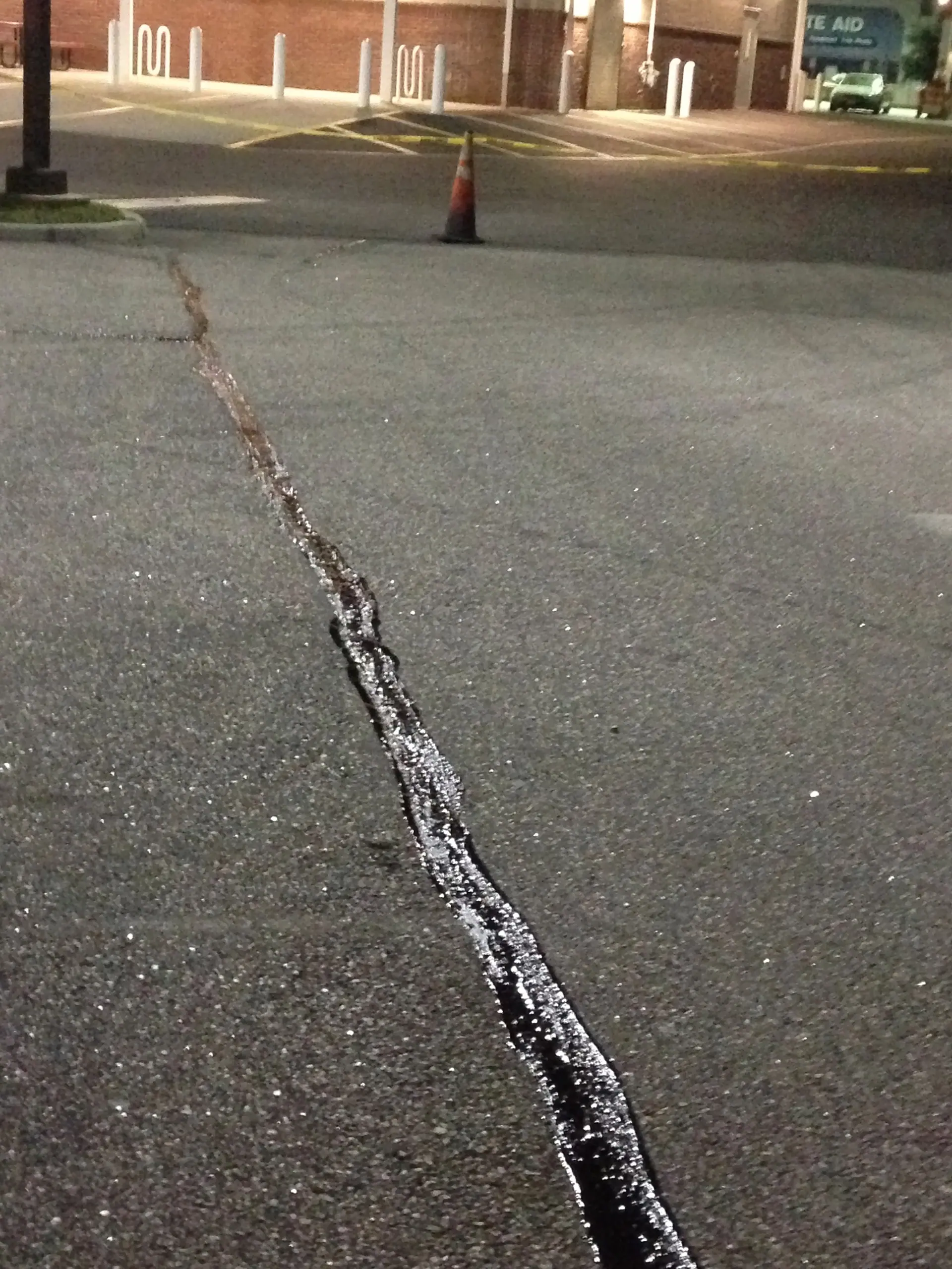 Crack seal going down after close at a shopping center