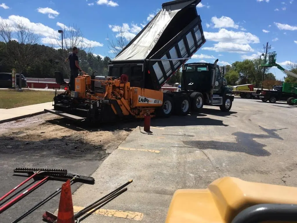 LeeBoy 8515 paver taking mix from the dump truck